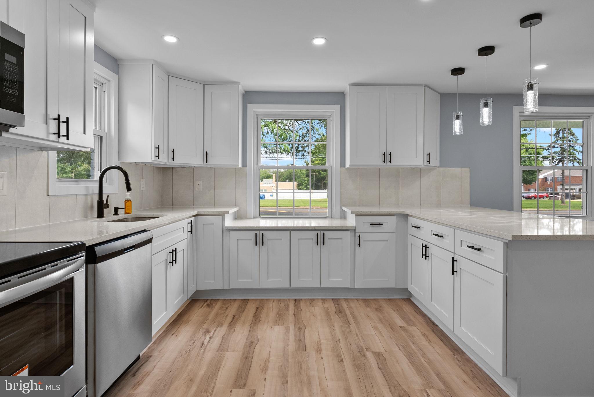 160 Church Road North Wales, PA 19454 - Photo 16 of 36 a kitchen with cabinets appliances and a window