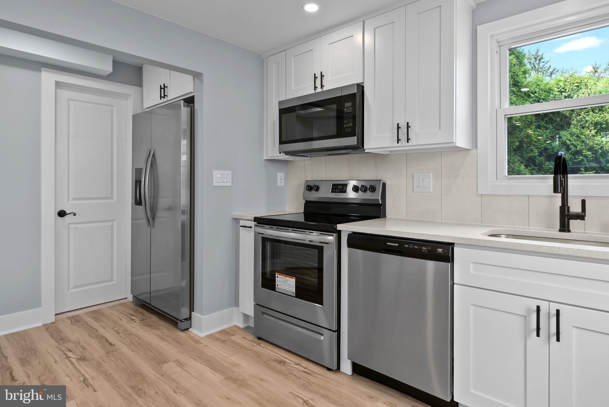 160 Church Road North Wales, PA 19454 - Photo 17 of 36 a kitchen with cabinets stainless steel appliances and window
