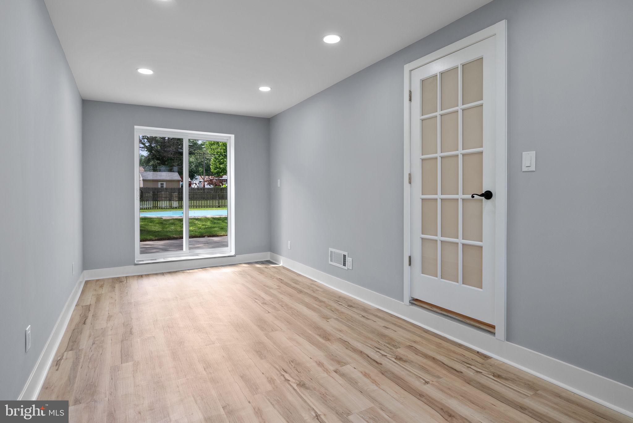 160 Church Road North Wales, PA 19454 - Photo 21 of 36 an empty room with wooden floor and windows