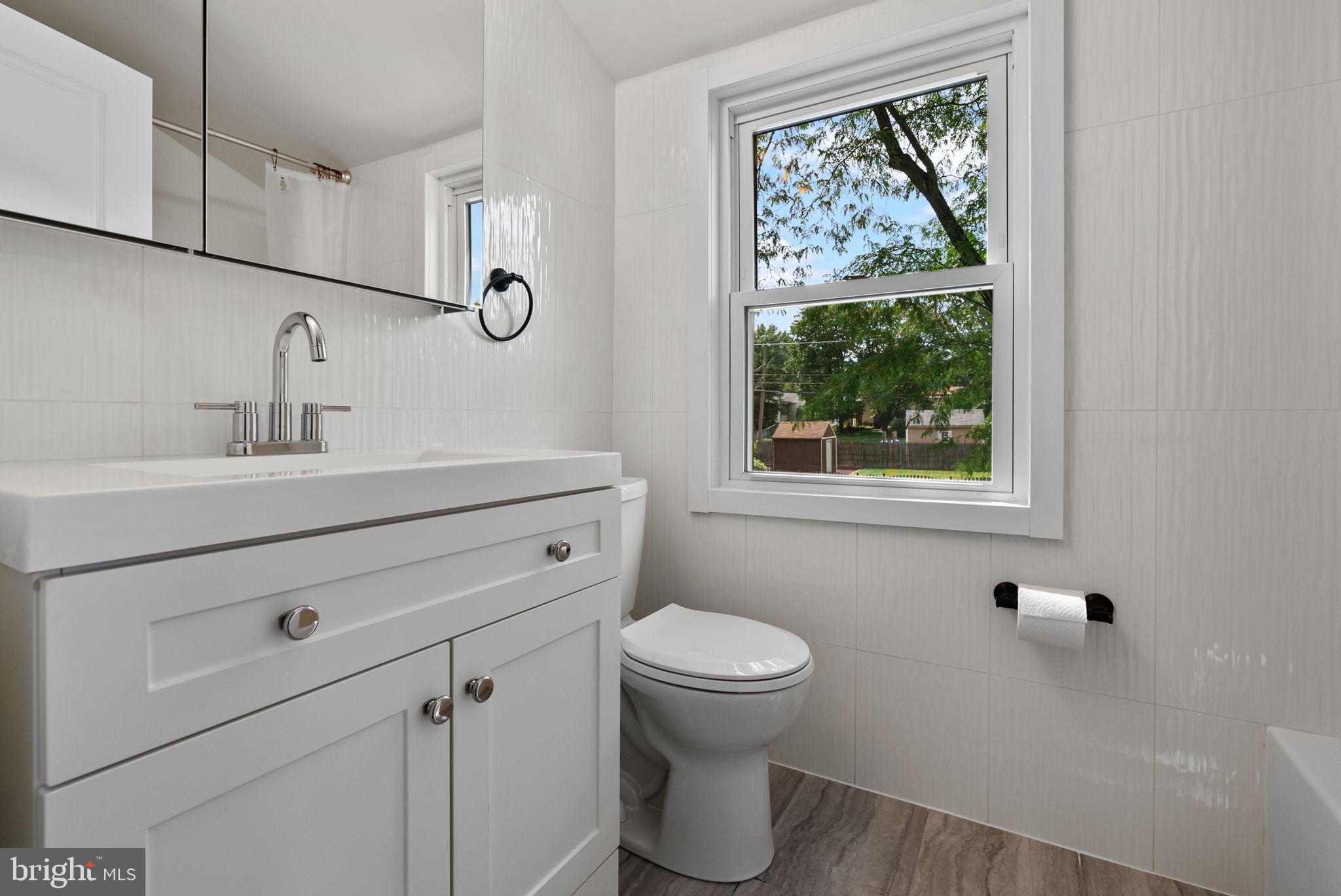 160 Church Road North Wales, PA 19454 - Photo 22 of 36 a bathroom with a toilet sink and mirror