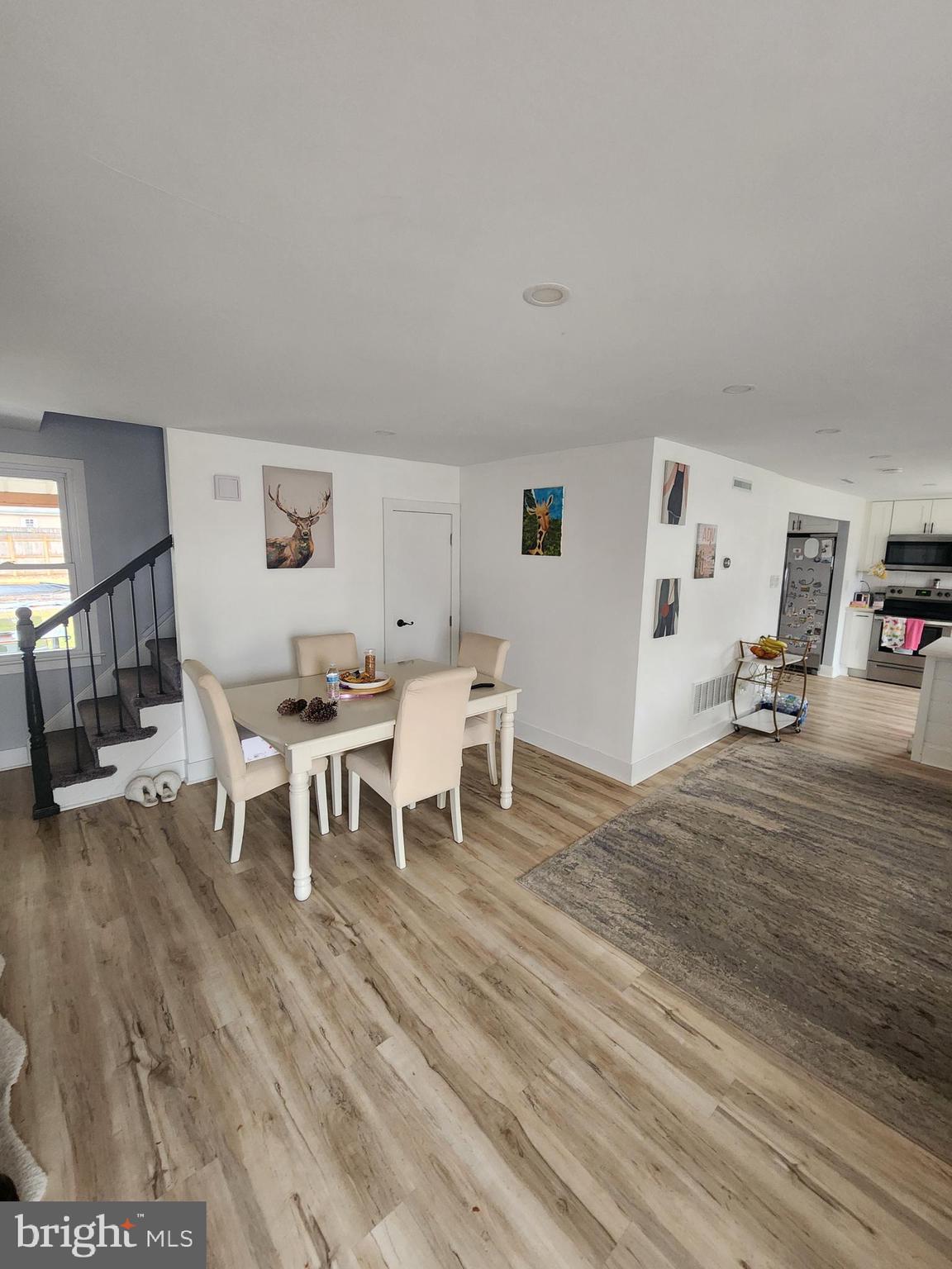 160 Church Road North Wales, PA 19454 - Photo 35 of 36 a living room with furniture a dining table and a wooden floor