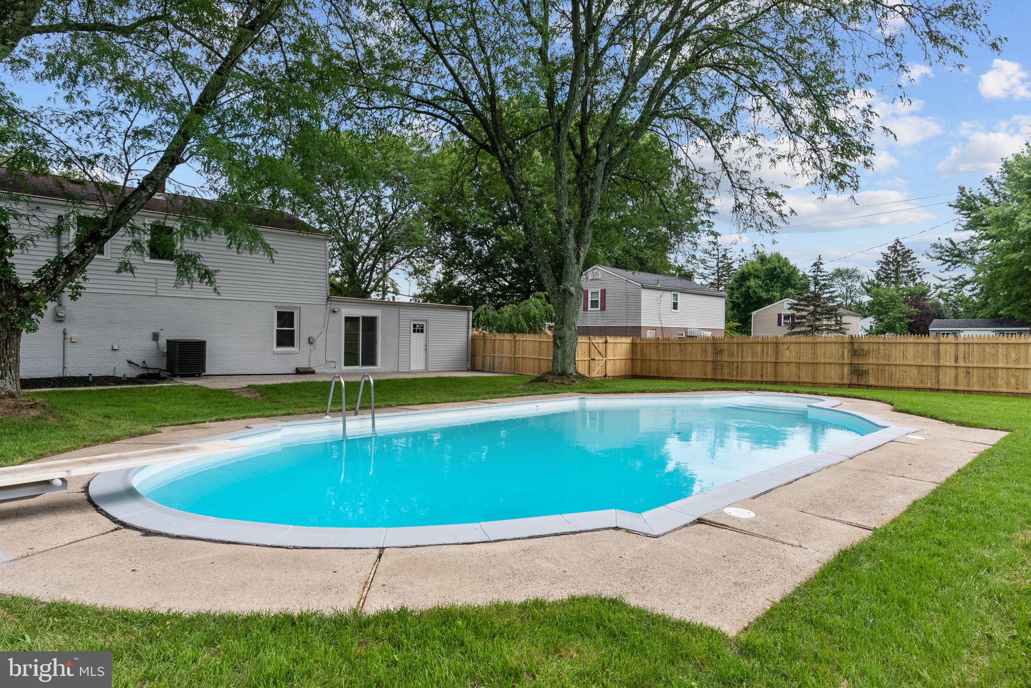 160 Church Road North Wales, PA 19454 - Photo 7 of 36 a view of a swimming pool with a yard