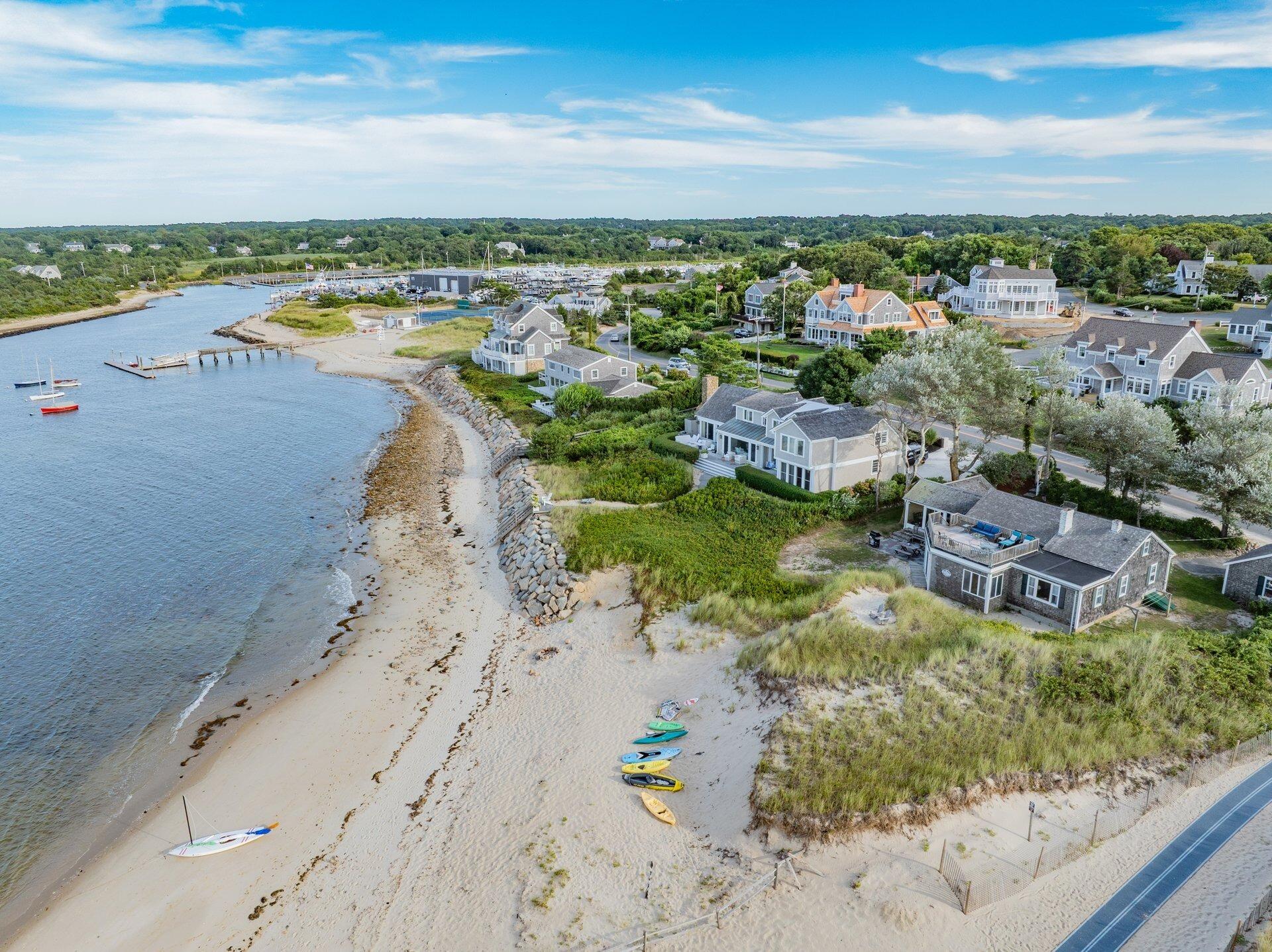 40 Harbor Road East Dennis, MA 02641 - Photo 2 of 32 a view of a city with an ocean beach
