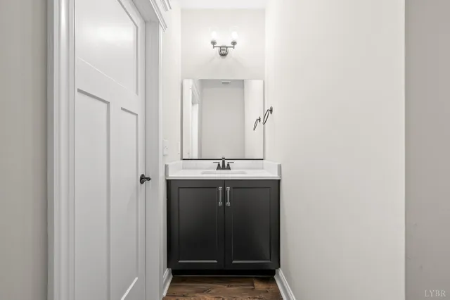 a view of an entryway with wooden floor and door