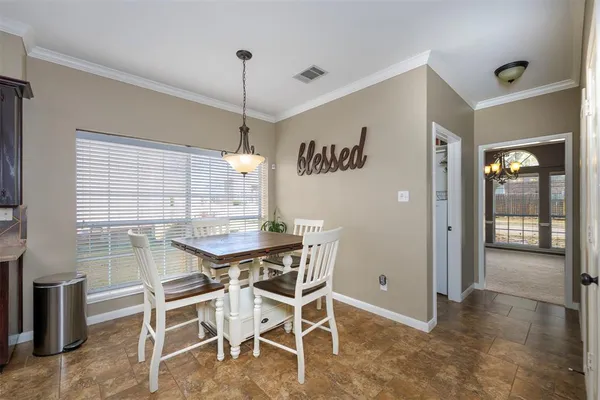 a large kitchen with a large counter top stainless steel appliances lots of counter space and windows