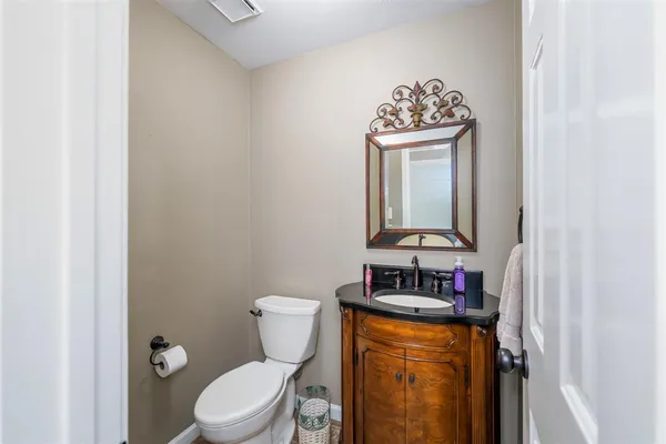 a view of a dining room with furniture and window