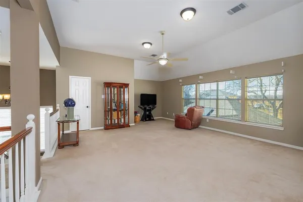a living room with furniture fireplace and flat screen tv