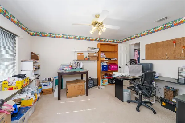 a view of a livingroom with furniture and staircase