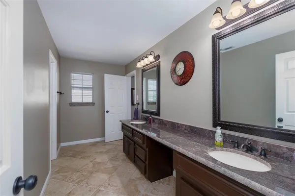 a view of a workspace with furniture and a kitchen