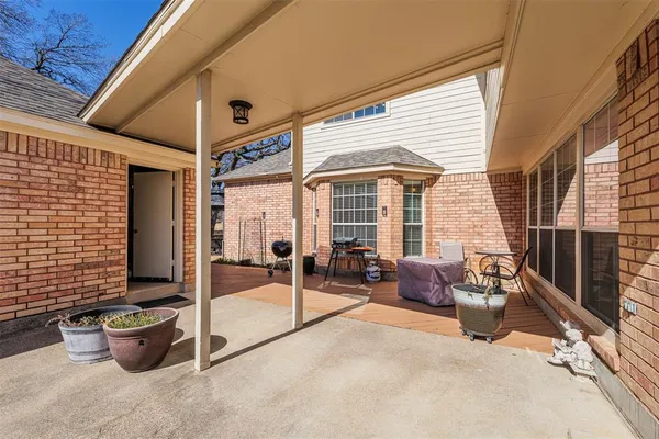 a bathroom with a granite countertop sink a large mirror and a shower
