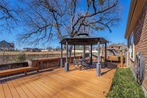 a building outdoor space with patio furniture and potted plants