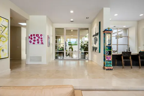 a view of a patio with swimming pool