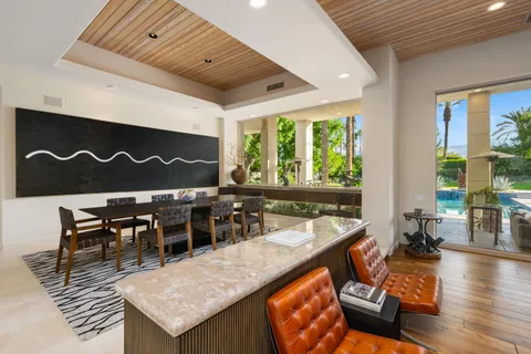 a kitchen with stainless steel appliances kitchen island granite countertop a sink and cabinets