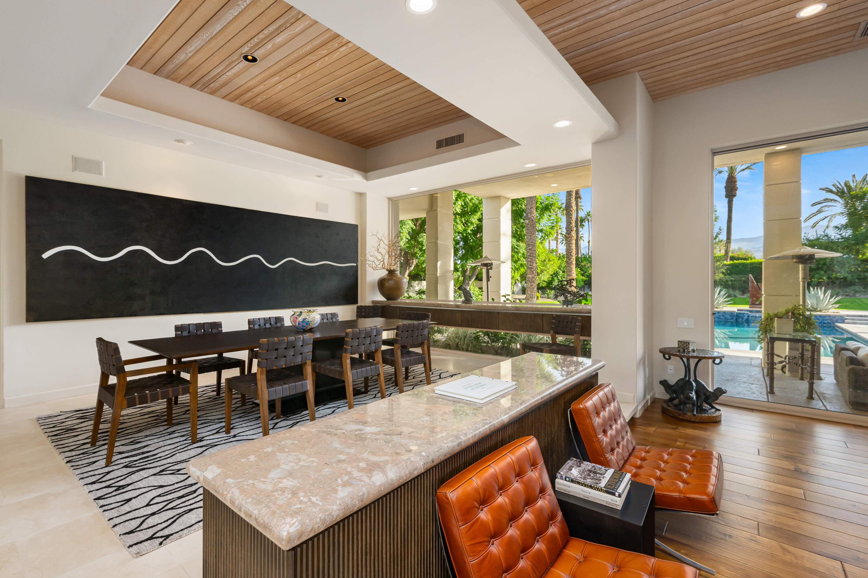 40745 Morningstar Road Rancho Mirage, CA 92270 - Photo 14 of 72 a dining hall with furniture and wooden floor
