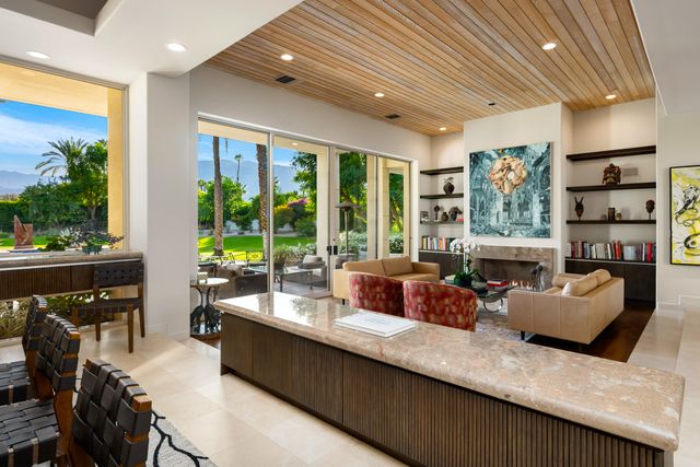 a kitchen with stainless steel appliances granite countertop sink stove and refrigerator