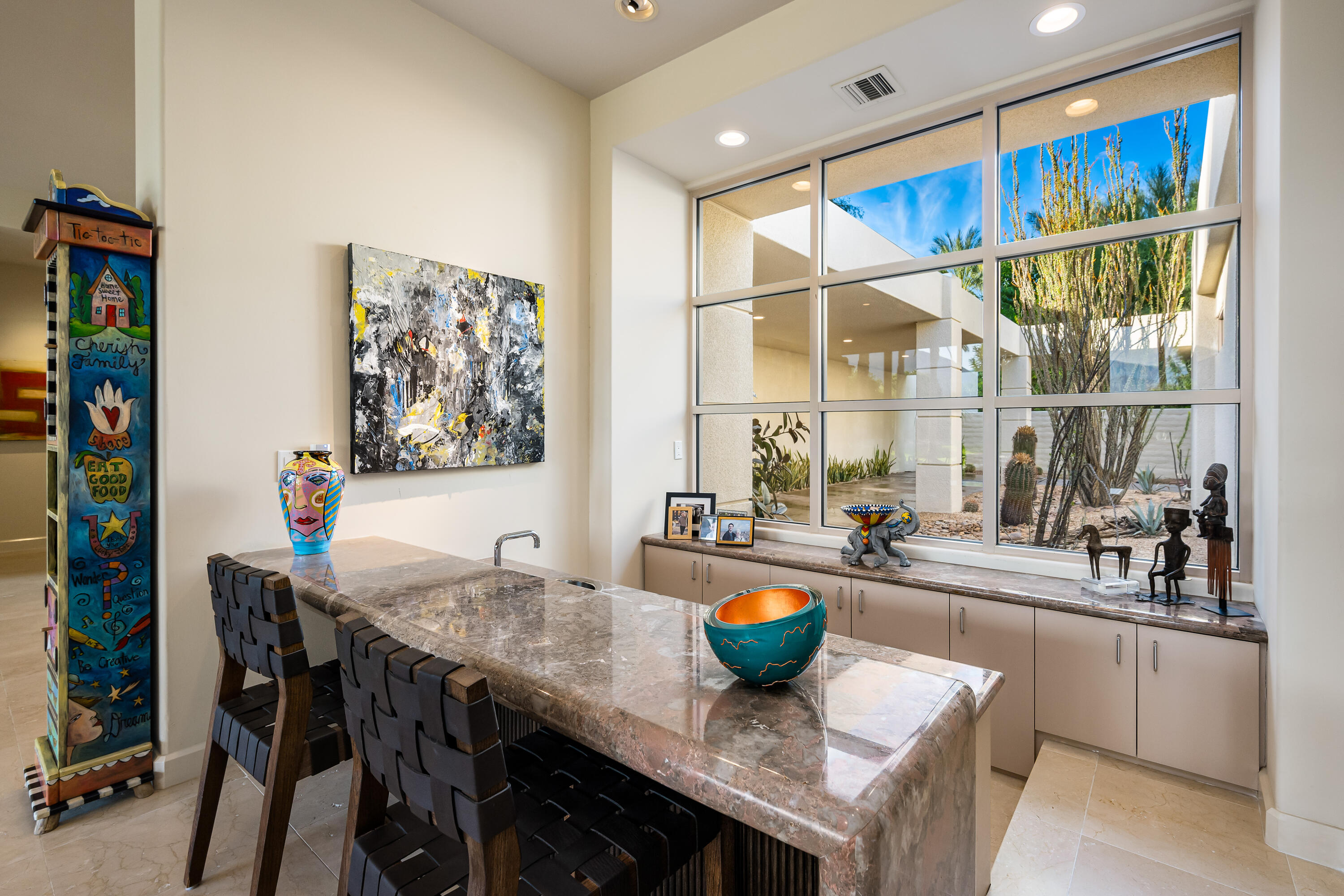 40745 Morningstar Road Rancho Mirage, CA 92270 - Photo 17 of 72 a kitchen with a table chairs and wooden floor