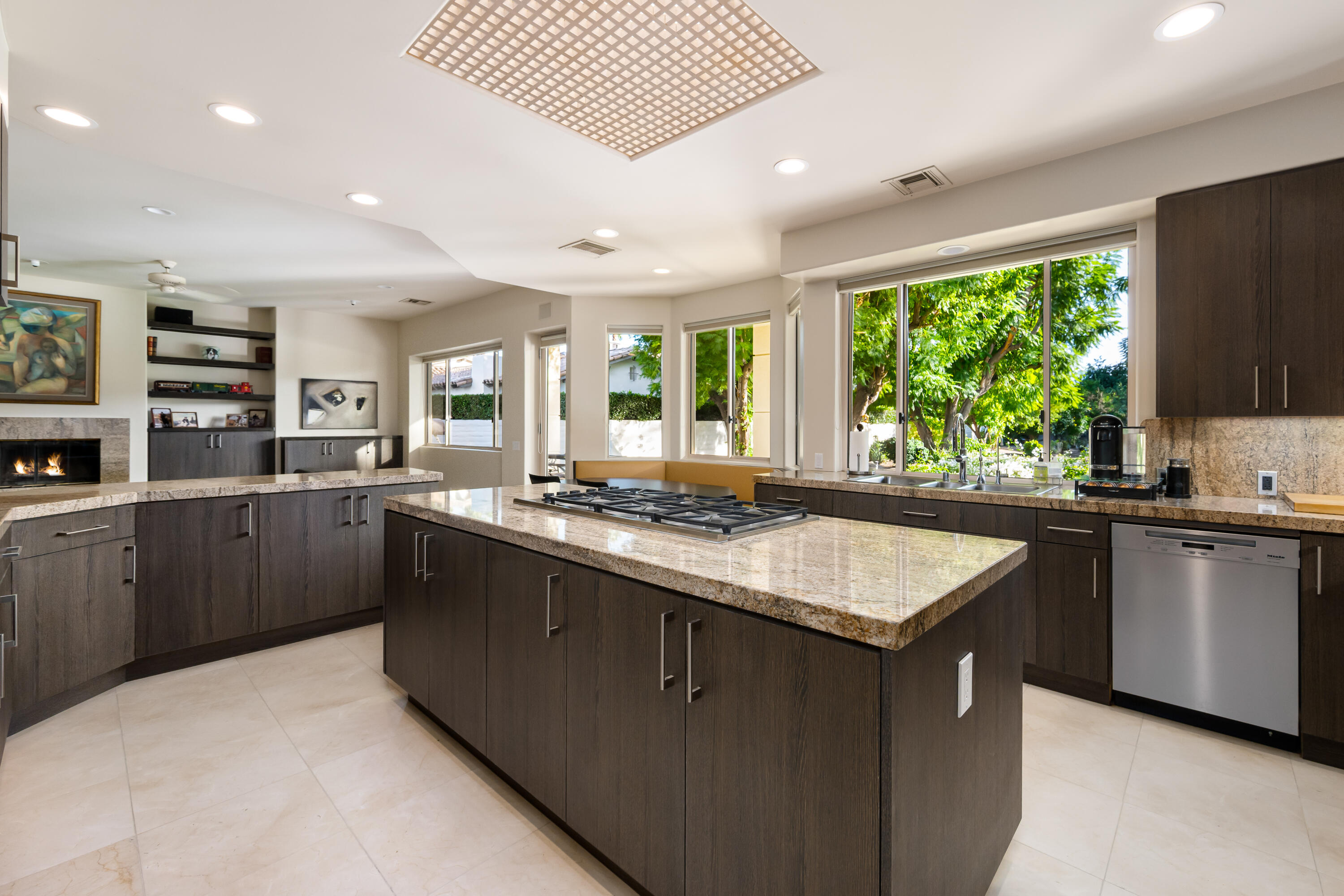 40745 Morningstar Road Rancho Mirage, CA 92270 - Photo 21 of 72 a kitchen with stainless steel appliances granite countertop sink stove and refrigerator