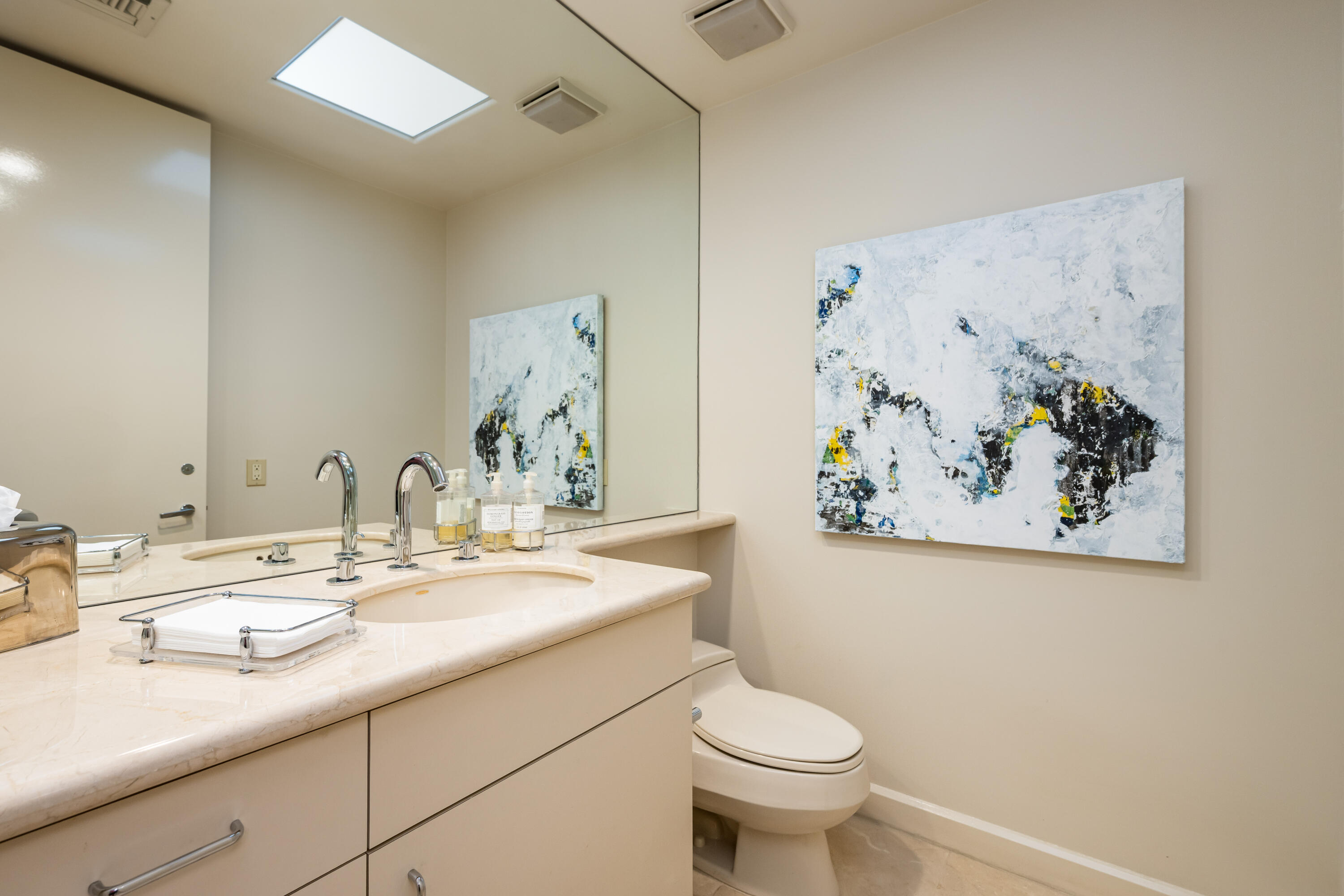 40745 Morningstar Road Rancho Mirage, CA 92270 - Photo 29 of 72 a bathroom with a sink mirror vanity and toilet
