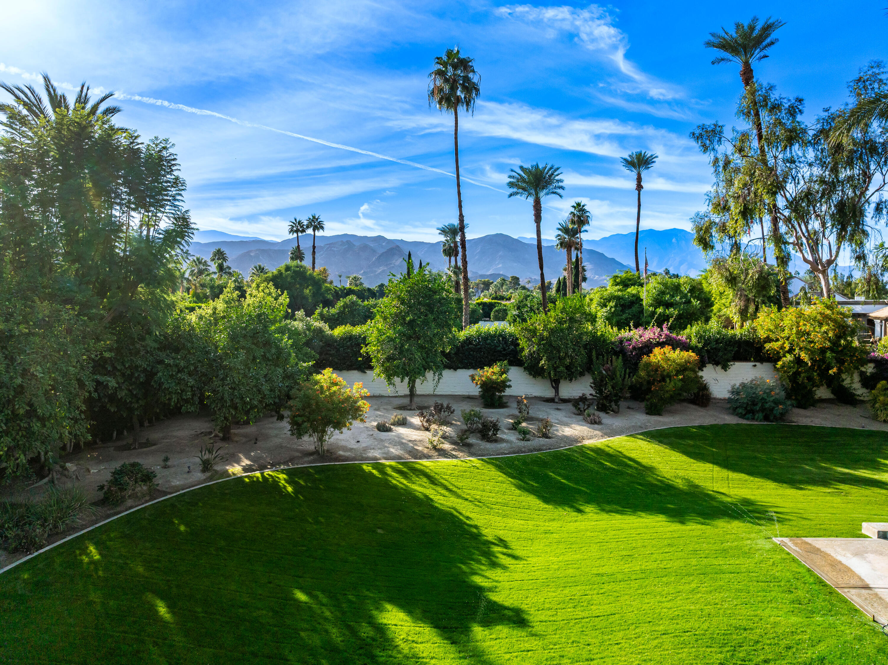 40745 Morningstar Road Rancho Mirage, CA 92270 - Photo 47 of 72 a view of a swimming pool with a yard