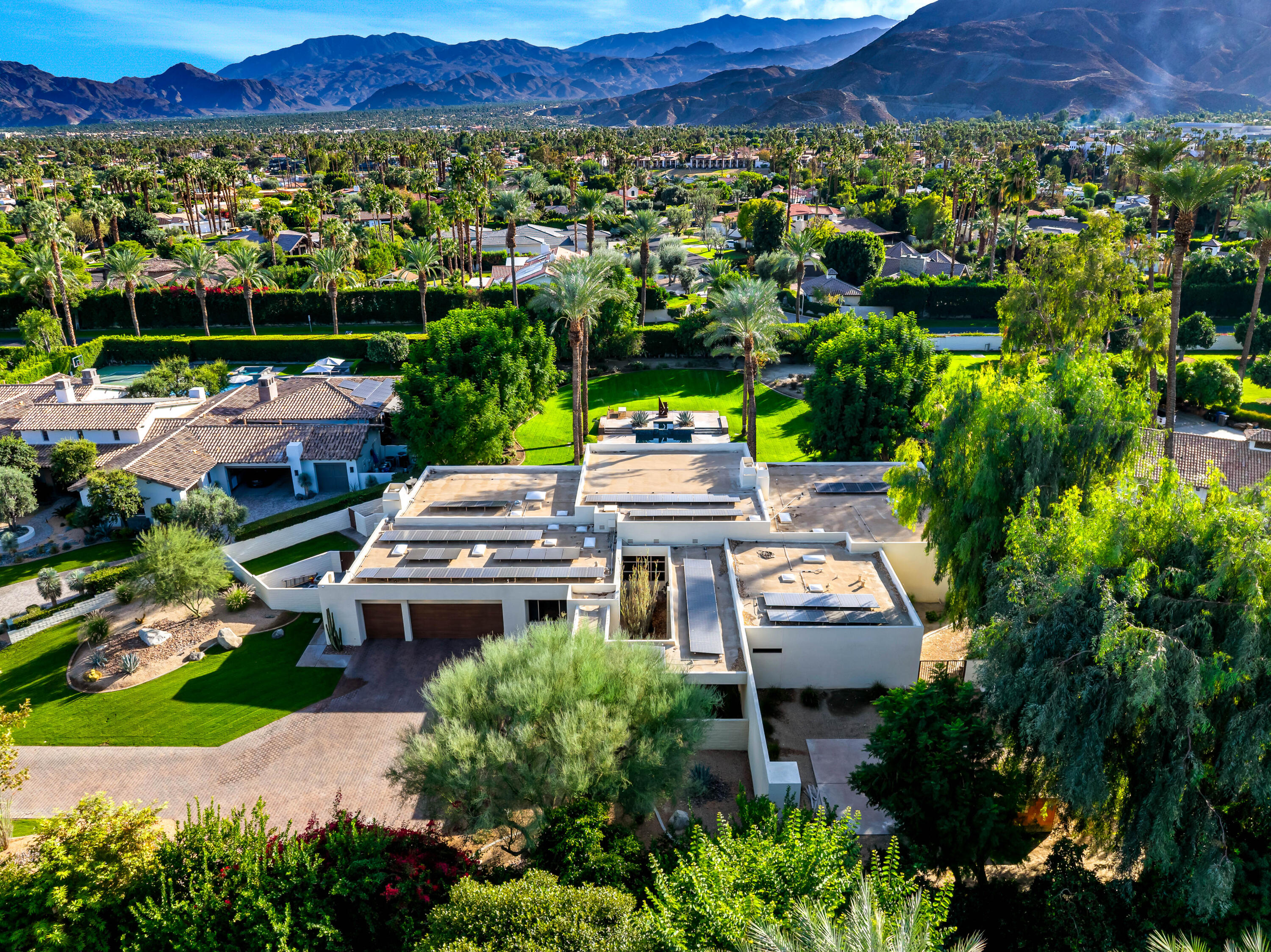 40745 Morningstar Road Rancho Mirage, CA 92270 - Photo 48 of 72 a backyard of a house with a yard and lake view