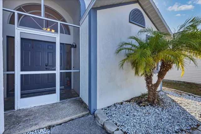 a vase of flowers sitting on a floor