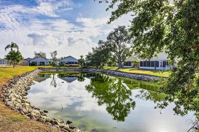 a view of a lake with a house in the background