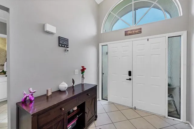 a view of an entryway with cabinet