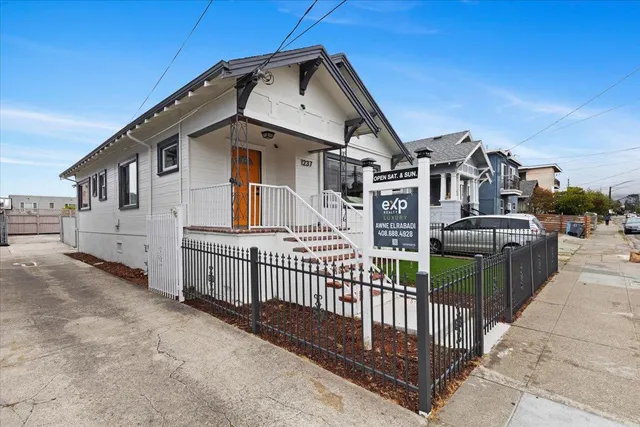 a balcony with furniture and a garden