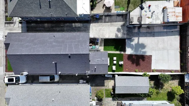 an aerial view of residential houses with city view