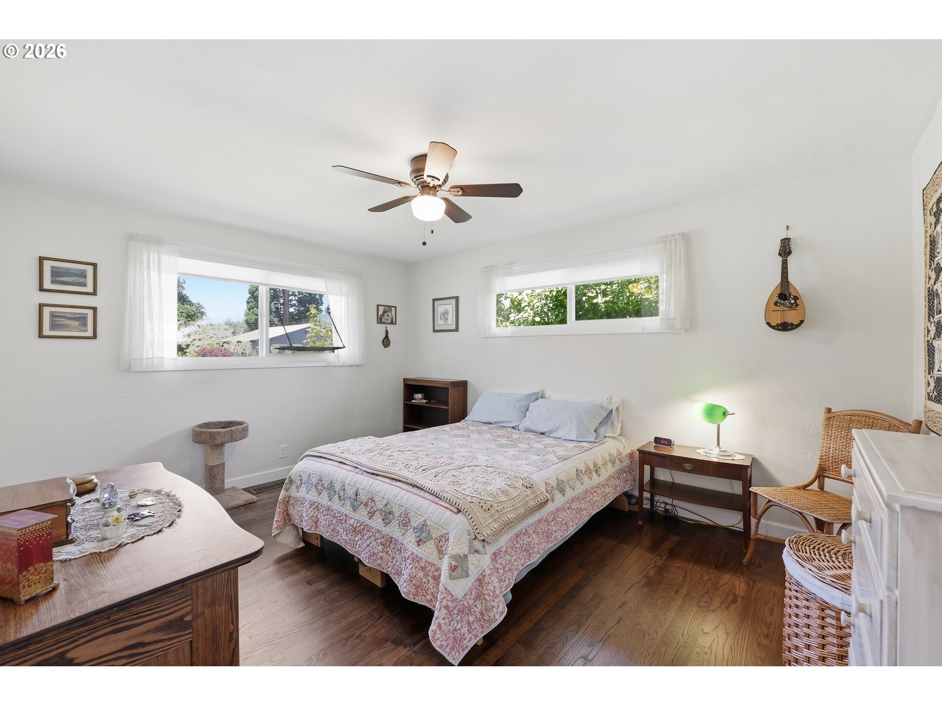 65 Greenvale Drive Springfield, OR 97477 - Photo 27 of 42 a bedroom with a bed and a chandelier