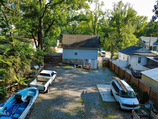 a view of a chairs and table in backyard