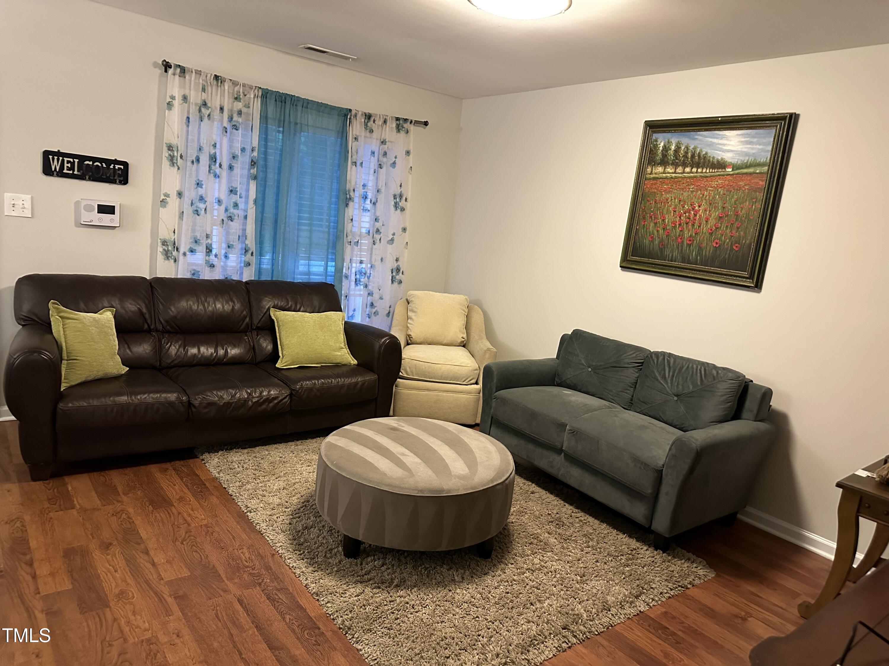 312 East End Avenue Durham, NC 27703 - Photo 3 of 18 a living room with furniture and a wooden floor