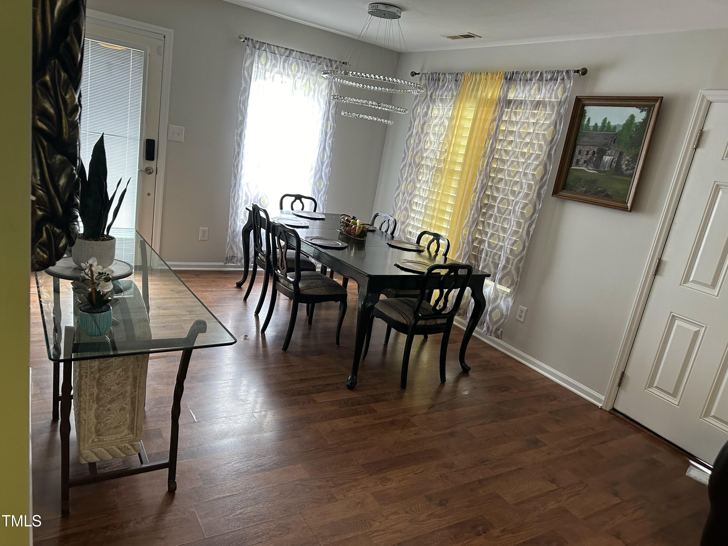 312 East End Avenue Durham, NC 27703 - Photo 6 of 18 a view of a dining room with furniture and a window
