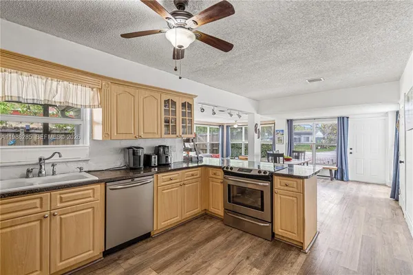 a kitchen with lots of counter top space and a sink