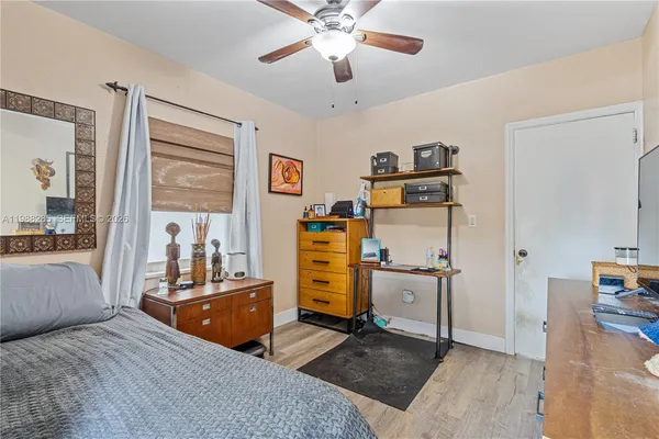 a bed room with a bed and furniture