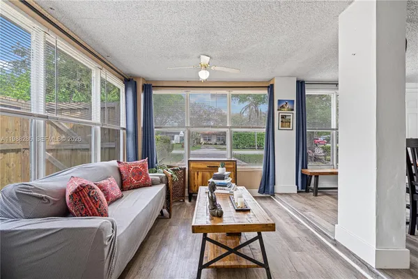 a living room with furniture and a large window