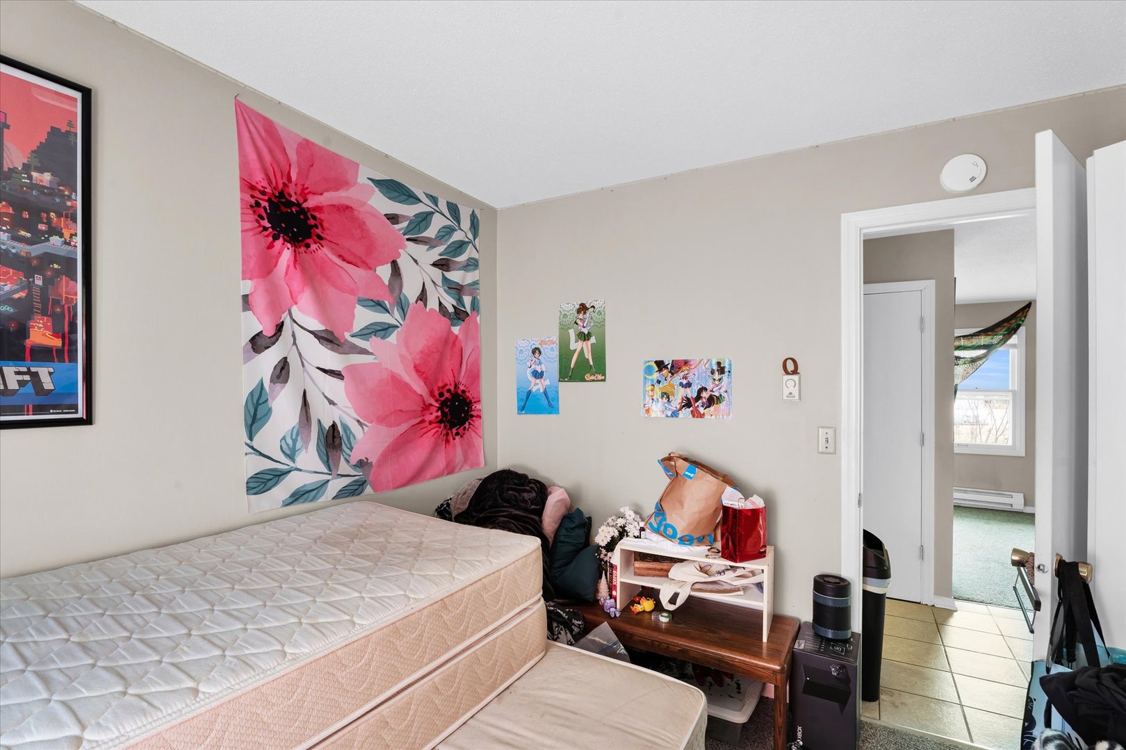 309 West Springfield Avenue Urbana, IL 61801 - Photo 13 of 35 a bed room with a bed and a couch