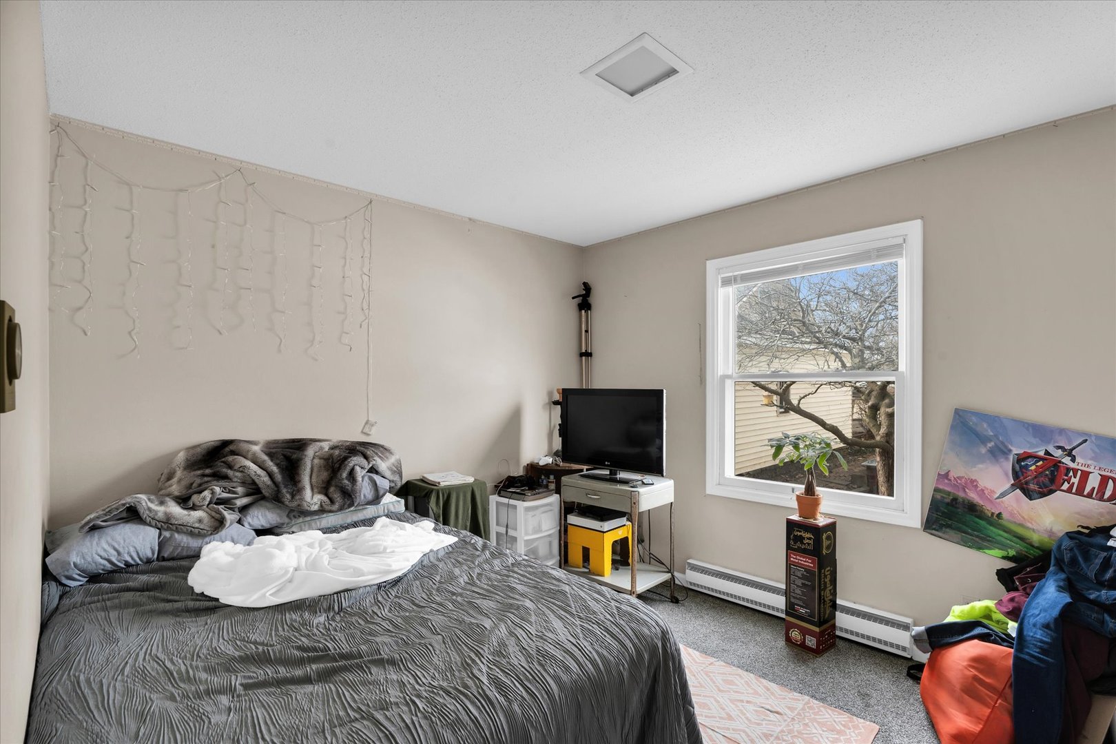 309 West Springfield Avenue Urbana, IL 61801 - Photo 14 of 35 a bedroom with a bed and a window