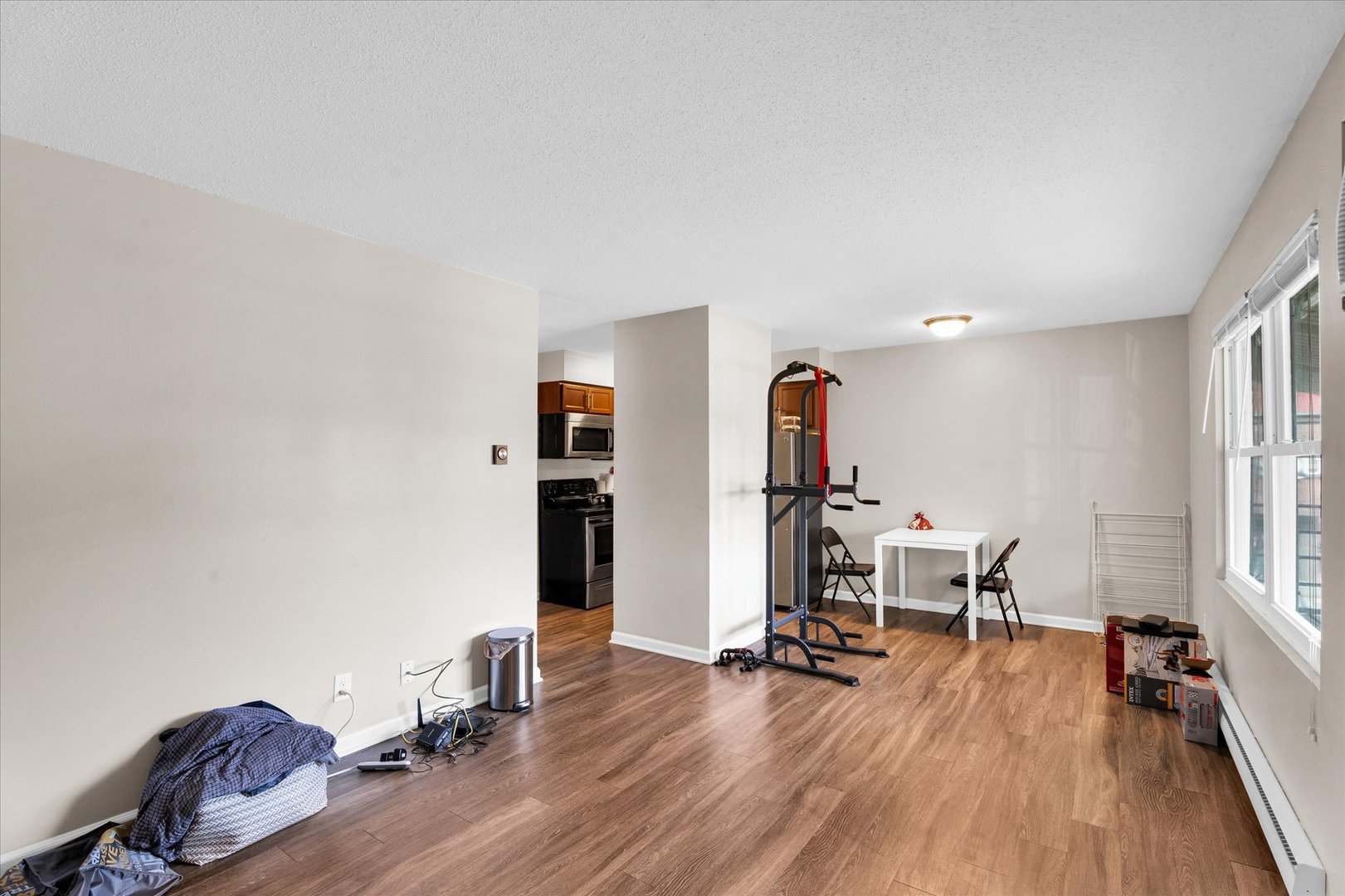 309 West Springfield Avenue Urbana, IL 61801 - Photo 19 of 35 a view of a workspace with furniture and wooden floor