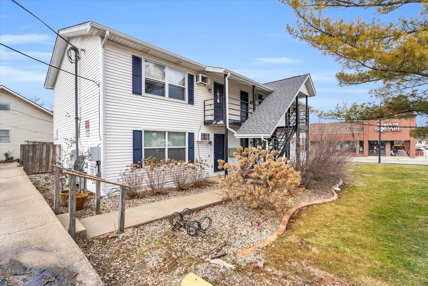 309 West Springfield Avenue Urbana, IL 61801 - Photo 2 of 35 a front view of a house with swimming pool