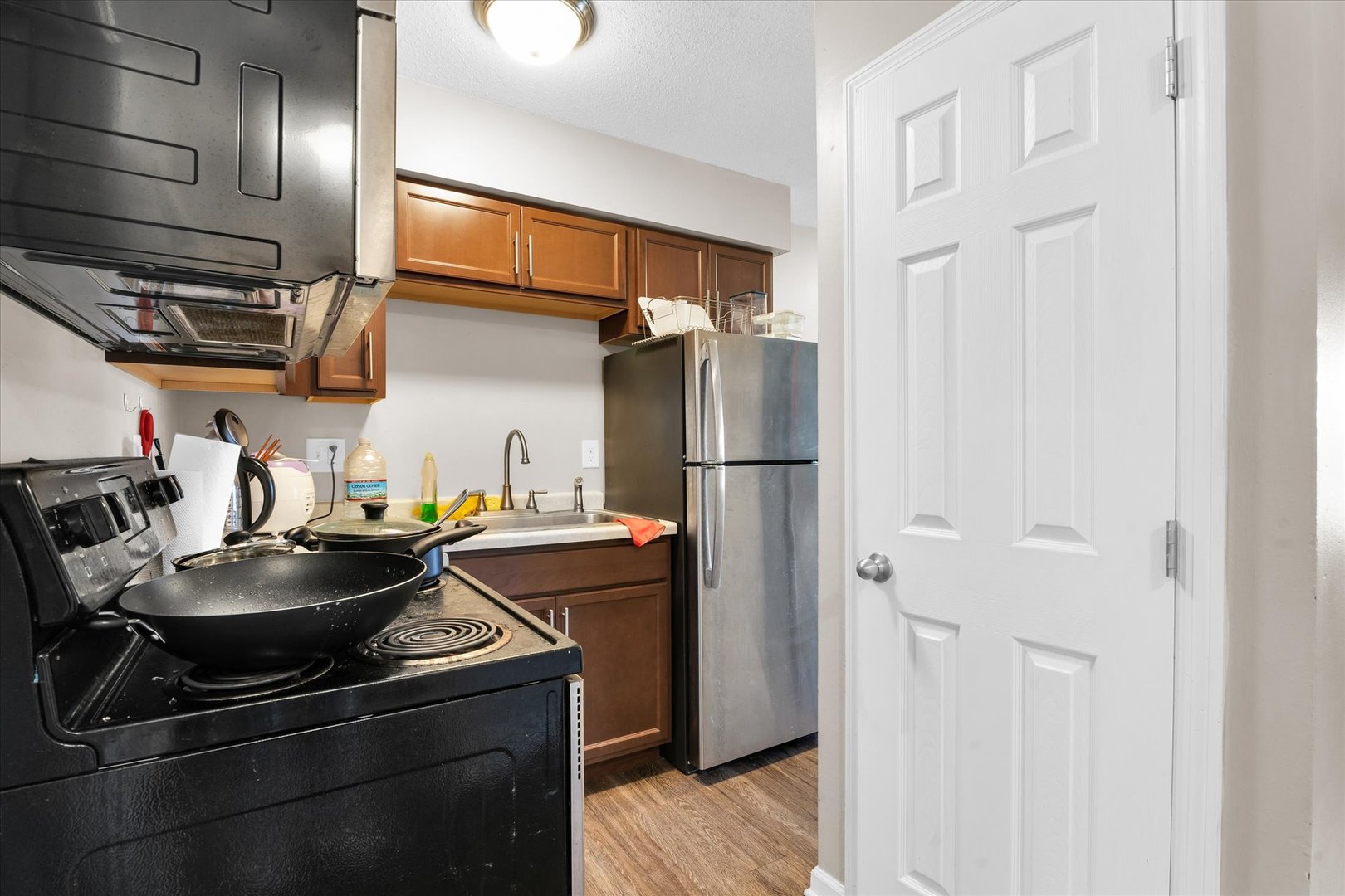 309 West Springfield Avenue Urbana, IL 61801 - Photo 22 of 35 a kitchen with stainless steel appliances granite countertop a refrigerator and a sink