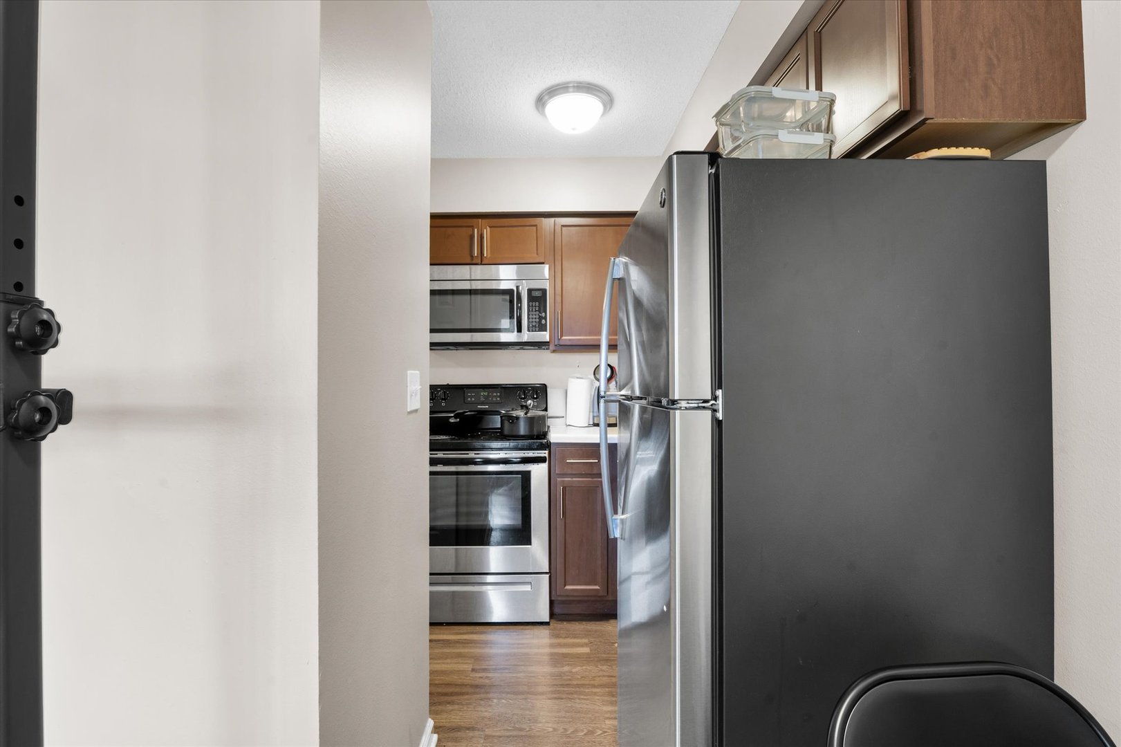 309 West Springfield Avenue Urbana, IL 61801 - Photo 23 of 35 a kitchen with stainless steel appliances granite countertop a refrigerator and a stove