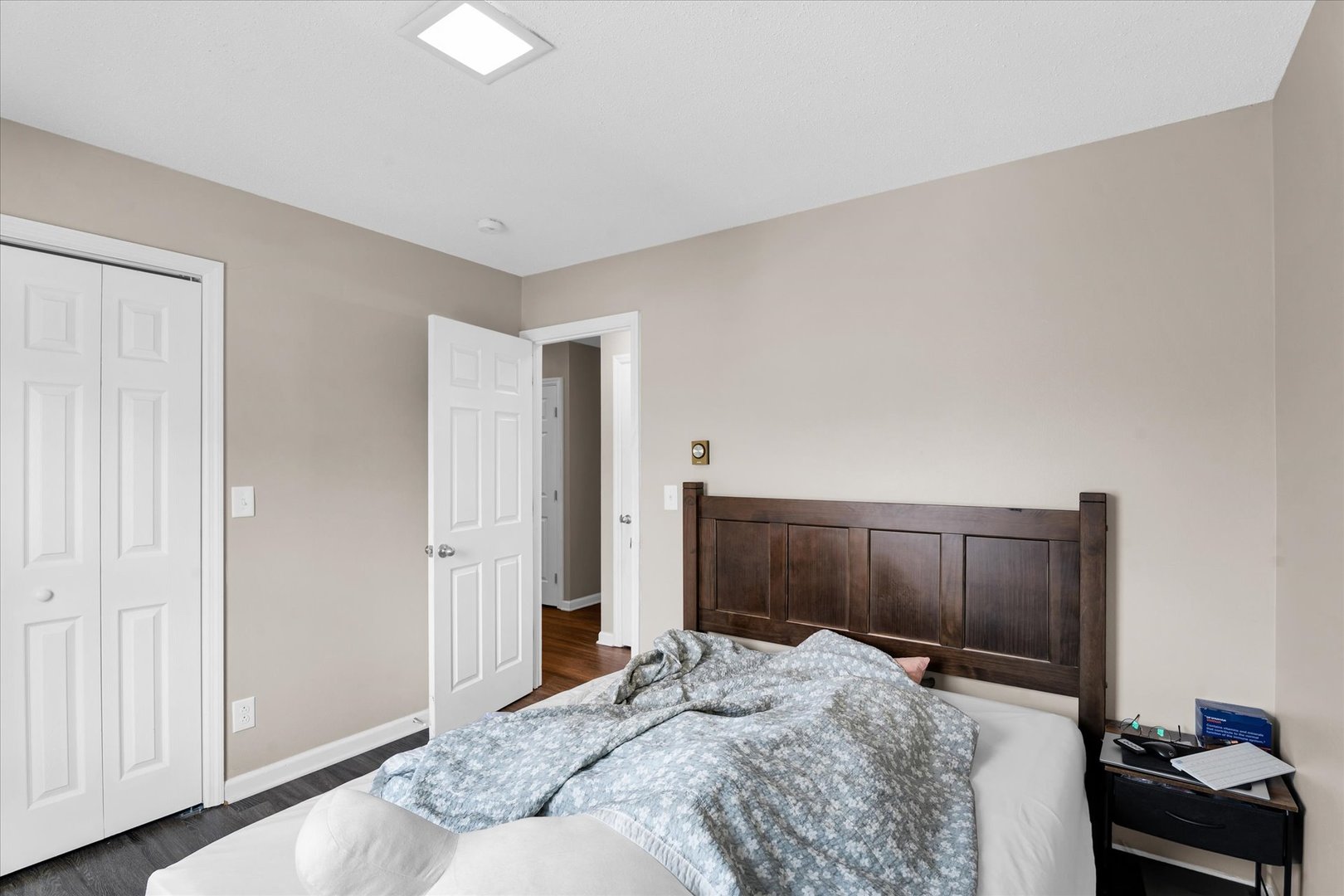 309 West Springfield Avenue Urbana, IL 61801 - Photo 27 of 35 a bedroom with a bed and a mirror