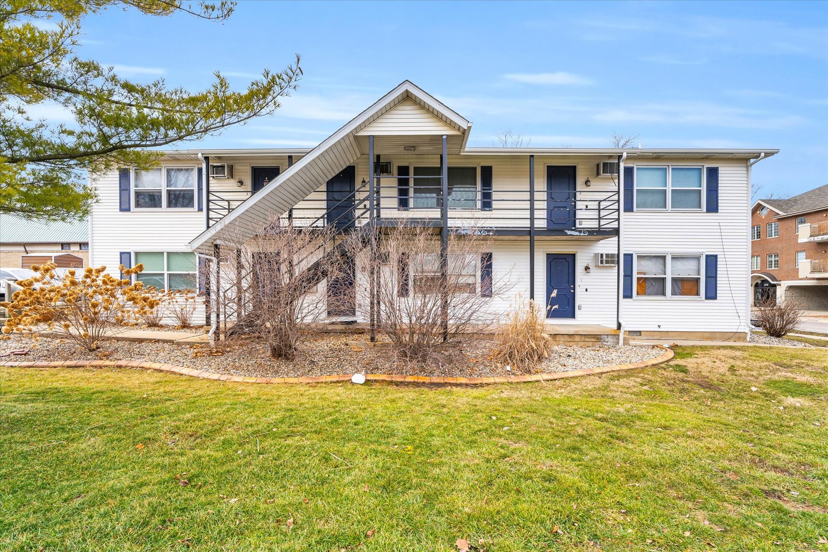 309 West Springfield Avenue Urbana, IL 61801 - Photo 34 of 35 a front view of a house with a yard