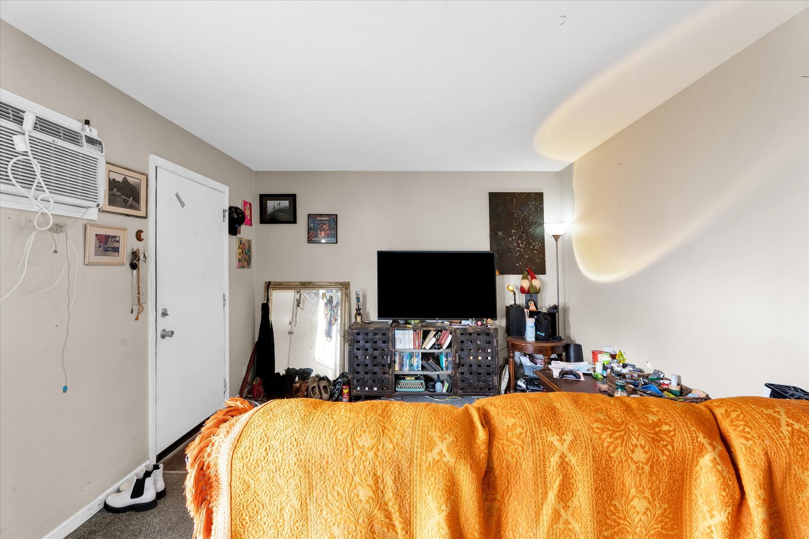 309 West Springfield Avenue Urbana, IL 61801 - Photo 6 of 35 a bedroom with a bed and a flat screen tv