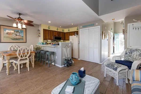 a kitchen with furniture a flat screen tv and a stove