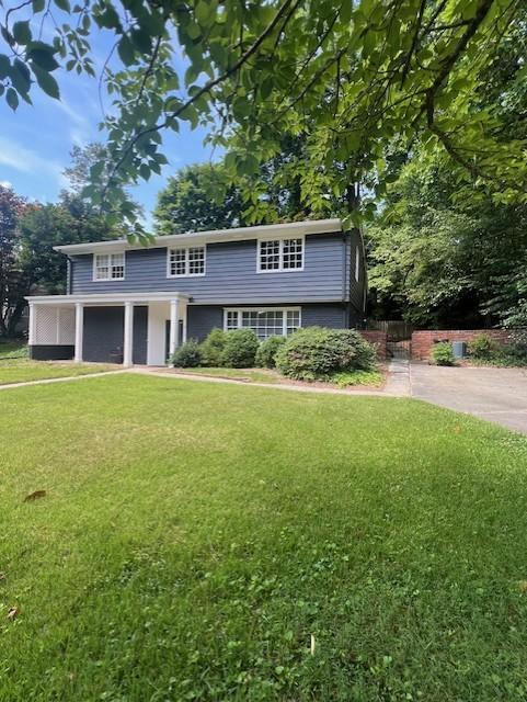 a view of a house with a yard