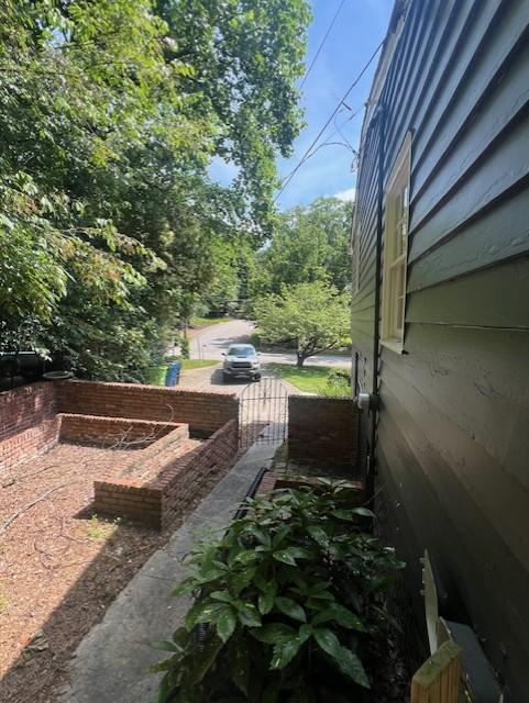 913 Brookwood Drive Raleigh, NC 27607 - Photo 20 of 26 a view of a yard with wooden fence