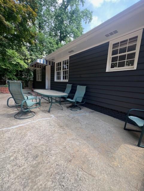 913 Brookwood Drive Raleigh, NC 27607 - Photo 8 of 26 a view of backyard with tv and outdoor seating
