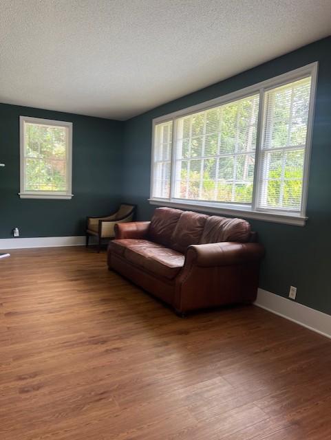 913 Brookwood Drive Raleigh, NC 27607 - Photo 10 of 26 a living room with furniture and a flat screen tv